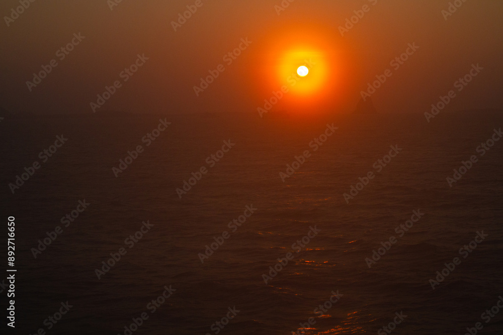 Fototapeta premium beautiful dramatic landscape of sunset on the sea beach