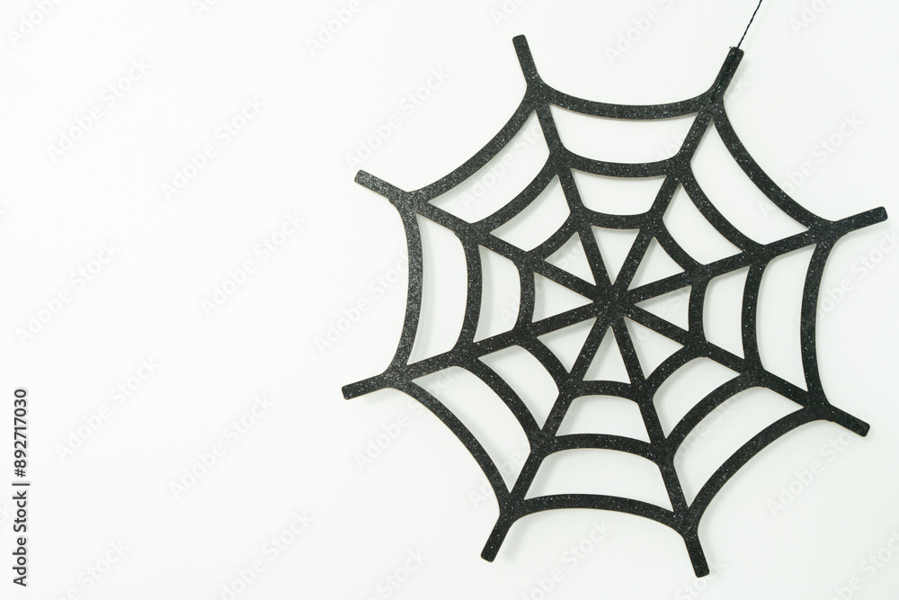 Black web on a white wall, Halloween decoration, autumn time Black web on a white wall, Halloween decoration, autumn time