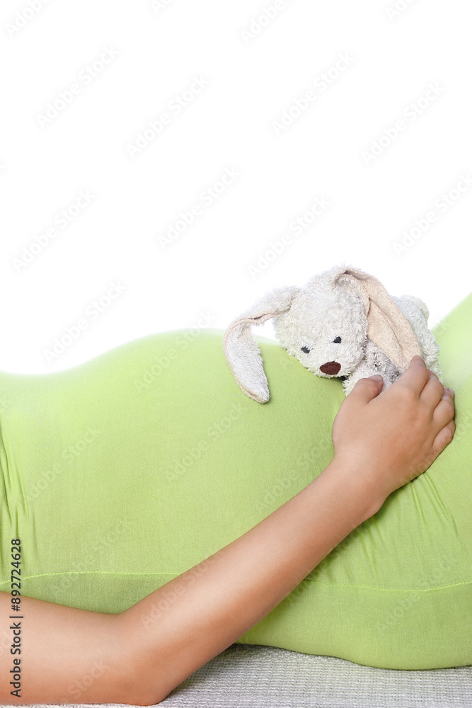 Happy pregnant girl lies on white background Happy pregnant girl lies on white background