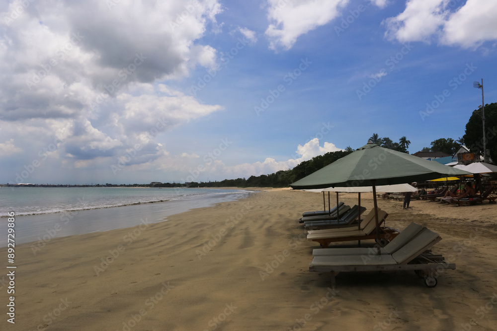 deck chairs and umbrellas on the sea beach in summer deck chairs and umbrellas on the sea beach in summer