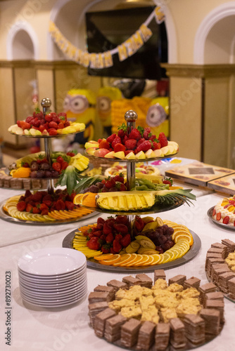 strawberries, pineapple and other exotic fruits on the buffet table