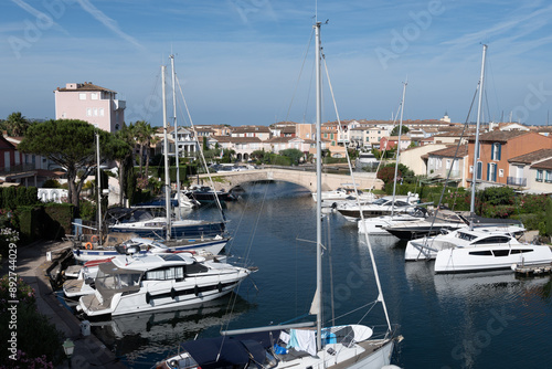 Travel and summer vacation destination, view on houses, roofs, canals and boats in Port Grimaud, Var, Provence, French Riviera, France photo