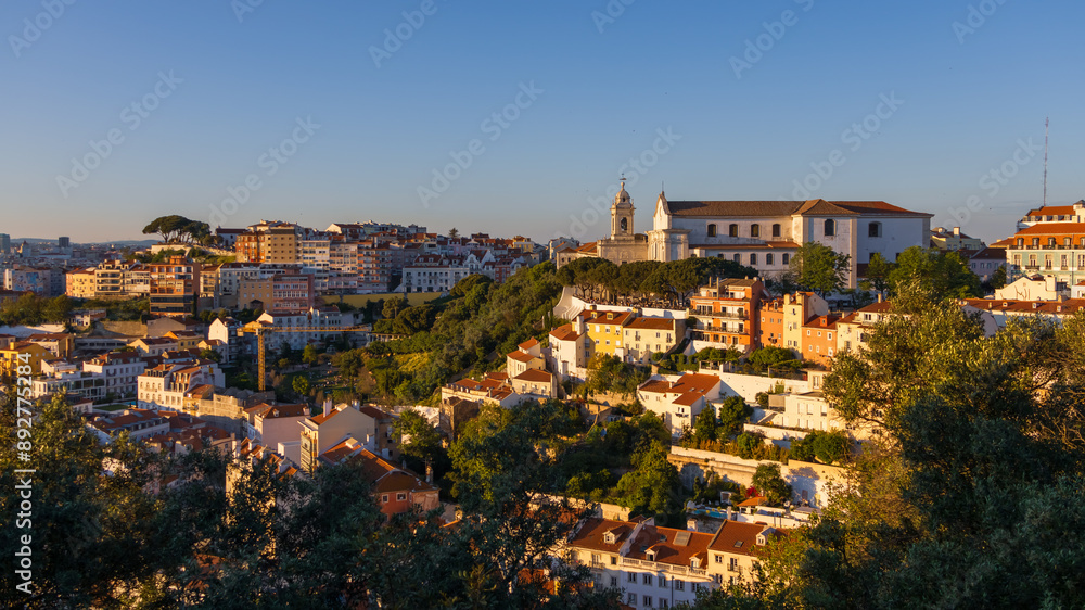 Obraz premium Aerial view of Lisbon cityscape, budlings with red roofs in Portugal, during sunset, the second-oldest European capital city