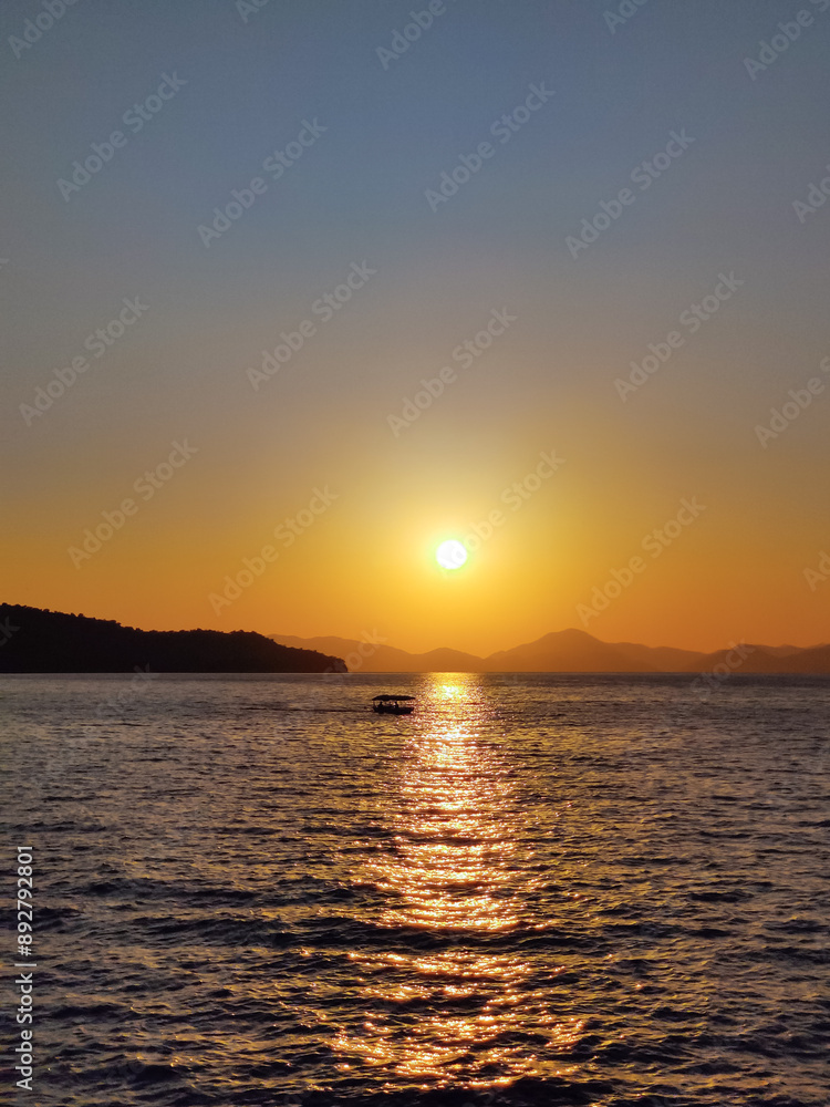 Obraz premium a beautiful ship is sailing in the blue sea