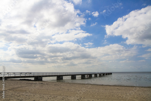 Wallpaper Mural a large long pier on a sea beach Torontodigital.ca