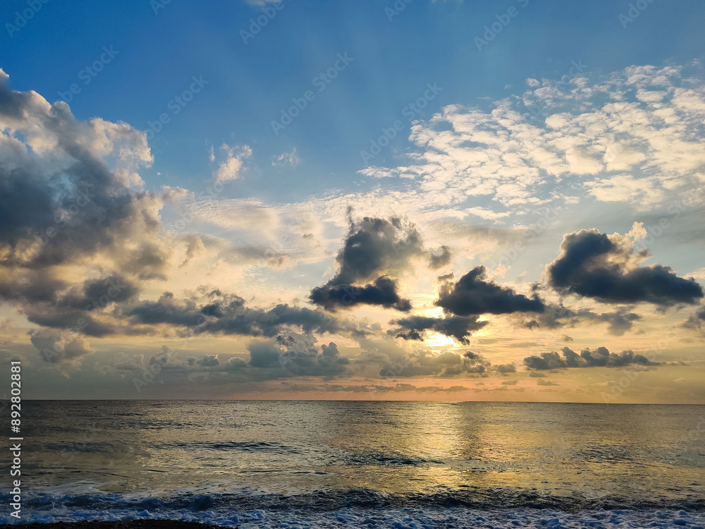 Fototapeta premium beautiful dramatic landscape of sunset on the sea beach