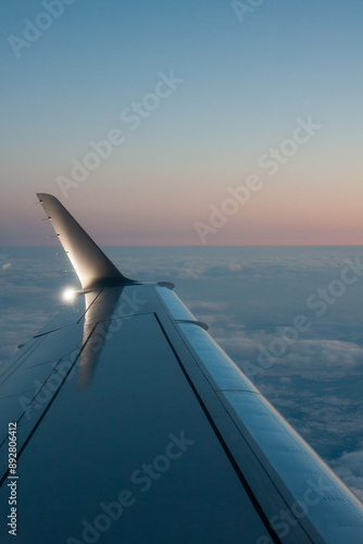 beautiful thick clouds in the sky from the height of the flight of the plane with a view of the wing with engines