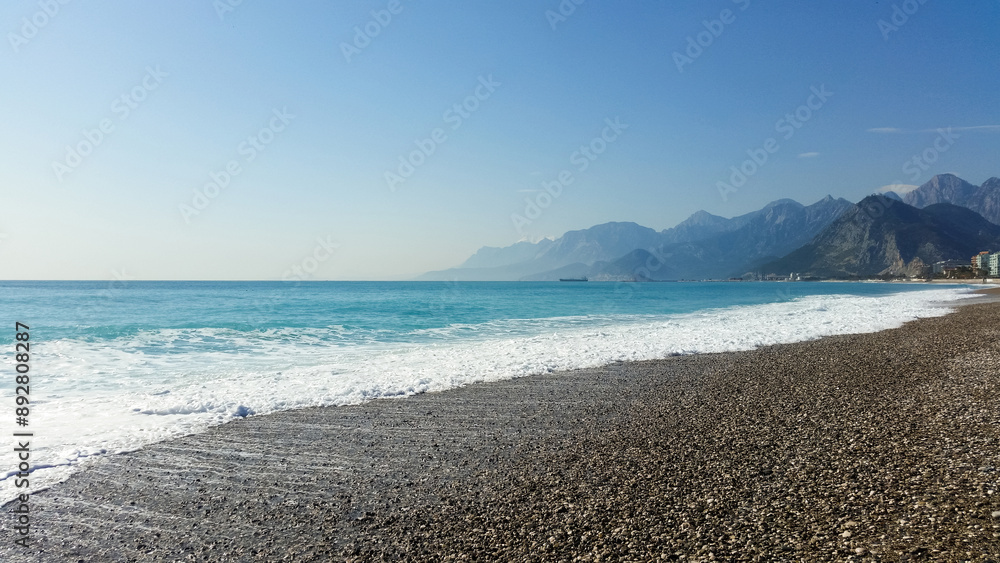 beautiful landscape on the coast of the beach and sea waves against the background of the blue sky beautiful landscape on the coast of the beach and sea waves against the background of the blue sky