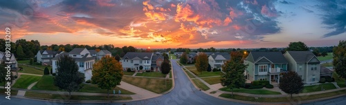 American real estate with single family homes brick façade, aerial sunset panorama of cul-de-sac (dead-end) luxury upscale residential neighborhood.