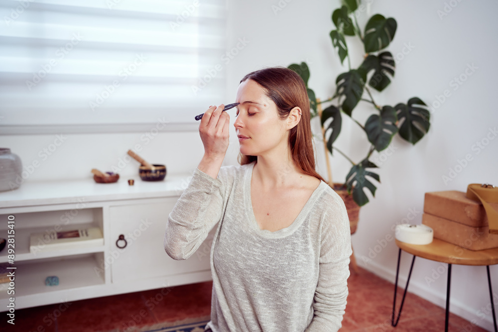 beautiful caucasian woman using acupressure tool in her forehead, facial yoga and anti aging beautiful caucasian woman using acupressure tool in her forehead, facial yoga and anti aging