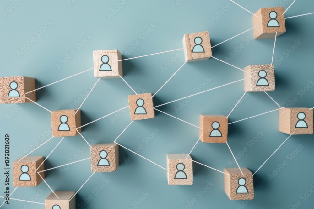 Teamwork concept with wooden blocks connected to a blue background Teamwork concept with wooden blocks connected to a blue background