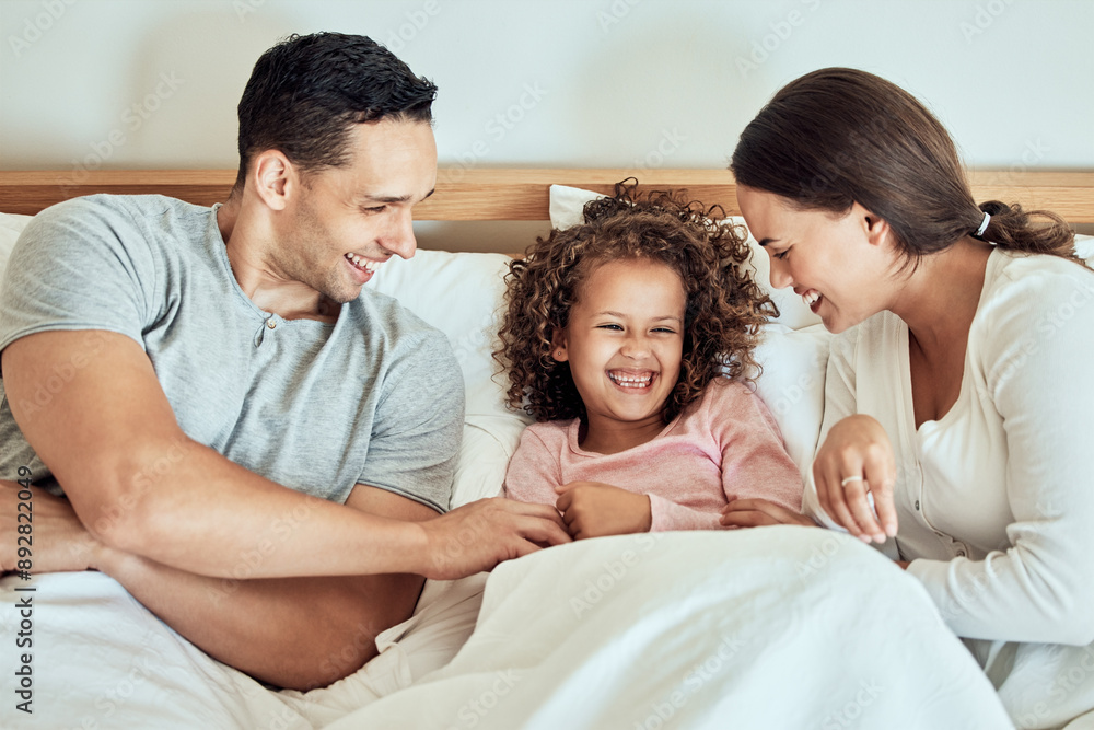 Obraz premium Happy, family and bed with girl and parents together with laugh, game and playing in the morning. Funny, mom smile and bonding with love, care and support in a home with rest in bedroom with joke