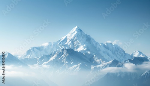 A detailed shot of a mountain peak surrounded by clear blue skies and fresh, crisp air, with snow-capped tops and a pristine landscape