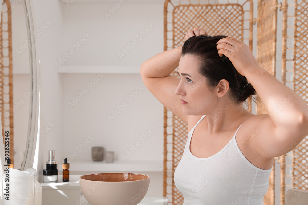 Woman with hair loss problem at home