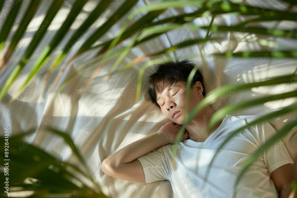 Cozy scene captures moment of serene leisure and individual peacefulness. His body unwinds he rests clutching rejuvenation of sleep. Peaceful nap symbolizes rejuvenation of body and spirit. Cozy scene captures moment of serene leisure and individual peacefulness. His body unwinds he rests clutching rejuvenation of sleep. Peaceful nap symbolizes rejuvenation of body and spirit.