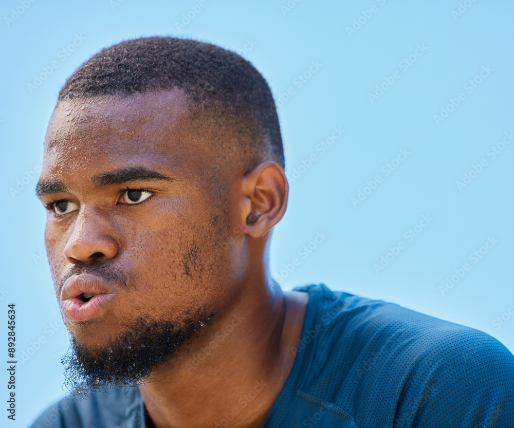Obraz premium Face, sports fitness and black man in nature ready for workout, exercise or training. Basketball, blue sky or serious male athlete from Nigeria with vision, focus or thinking about goals outdoors.