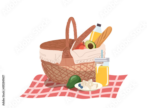 Healthy natural food and drinks in straw hamper for outdoor picnic isolated on white background