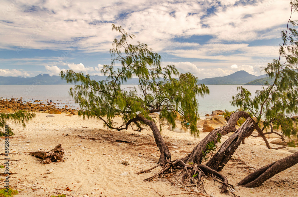 Picturesque tropical beach with boulders and turquoise water on Fitzroy Island. It is a continental island southeast of Cairns, Queensland, Australia. Picturesque tropical beach with boulders and turquoise water on Fitzroy Island. It is a continental island southeast of Cairns, Queensland, Australia.