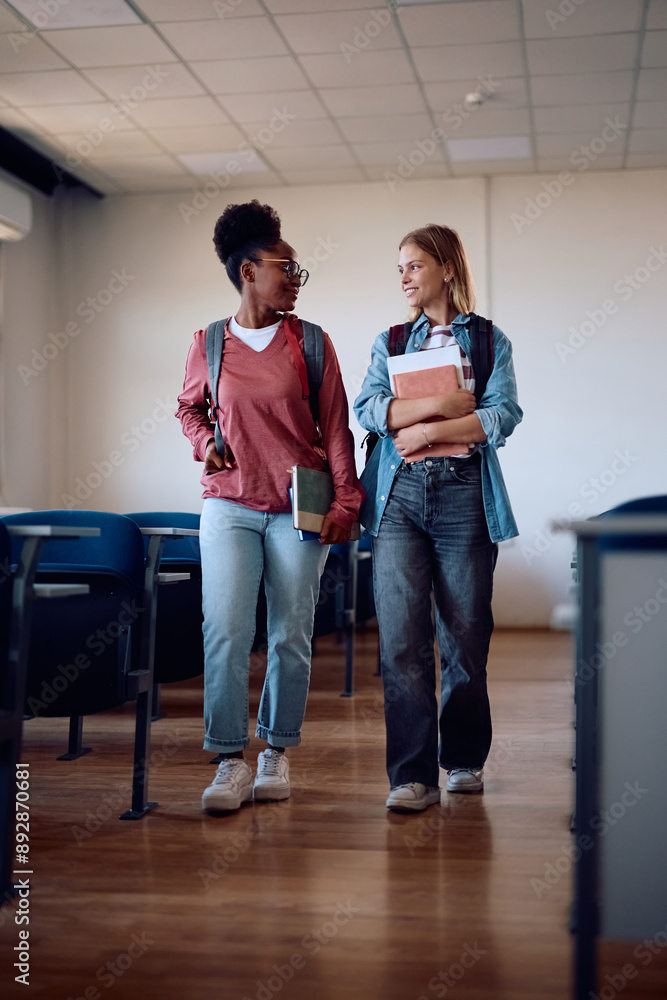 Fototapeta premium Female university friends leaving classroom after lecture.