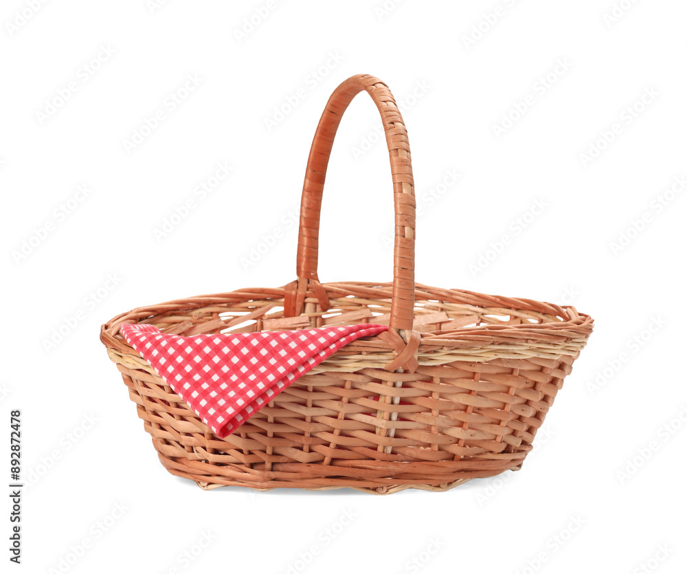 One picnic wicker basket with checkered napkin isolated on white One picnic wicker basket with checkered napkin isolated on white