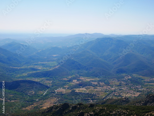 Panorama of a green mountain under cloudy skies in the south of France