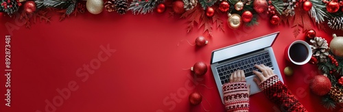 Person Typing on Laptop With Christmas Decorations