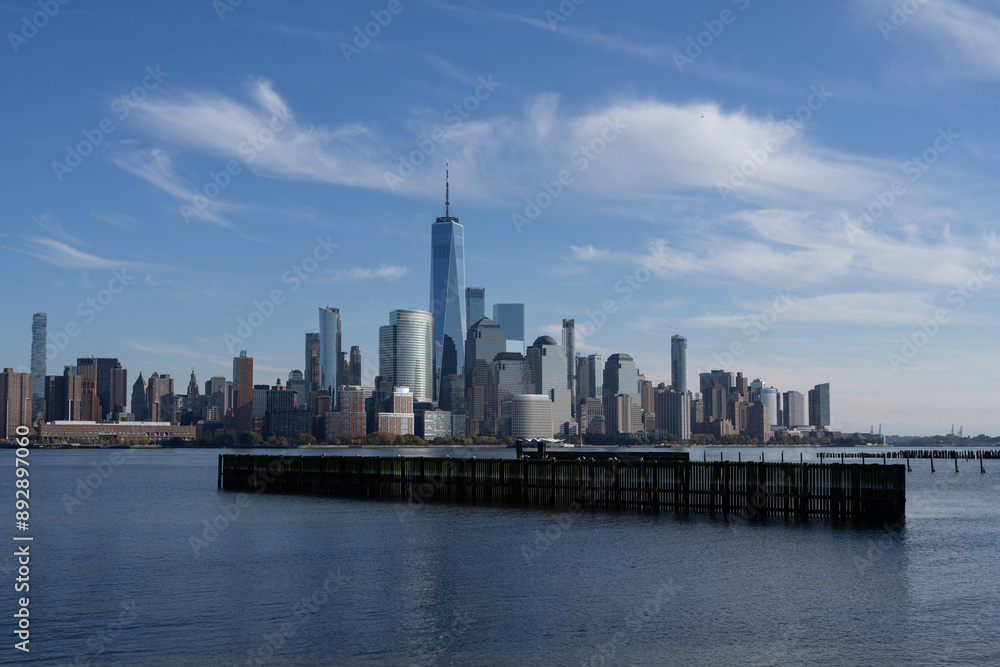 Naklejka premium New York, United States. New York city skyline in Midtown Manhattan. USA, NYC, NY, Manhattan. American big city. Lower Manhattan skyline. New York from New Jersey. Downtown Manhattan with blue sky.