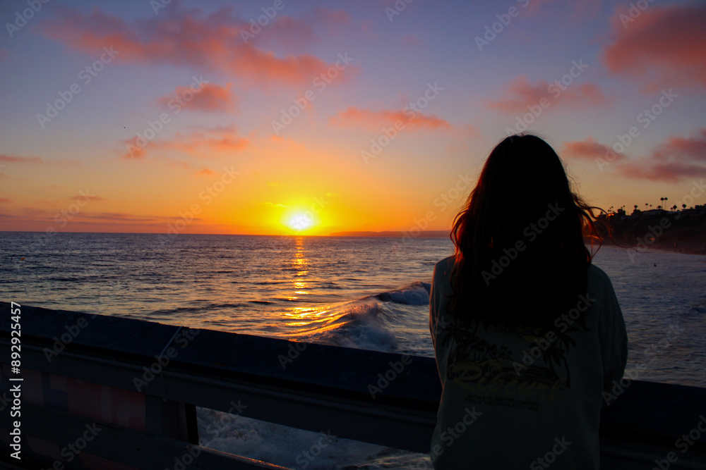 silhouette of a person on the beach at sunset silhouette of a person on the beach at sunset