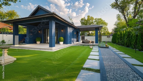 Modern blue luxury home, newly built, with a manicured green lawn and a decorative walkway to a stylish covered porch. Realistic HD capture. © design master