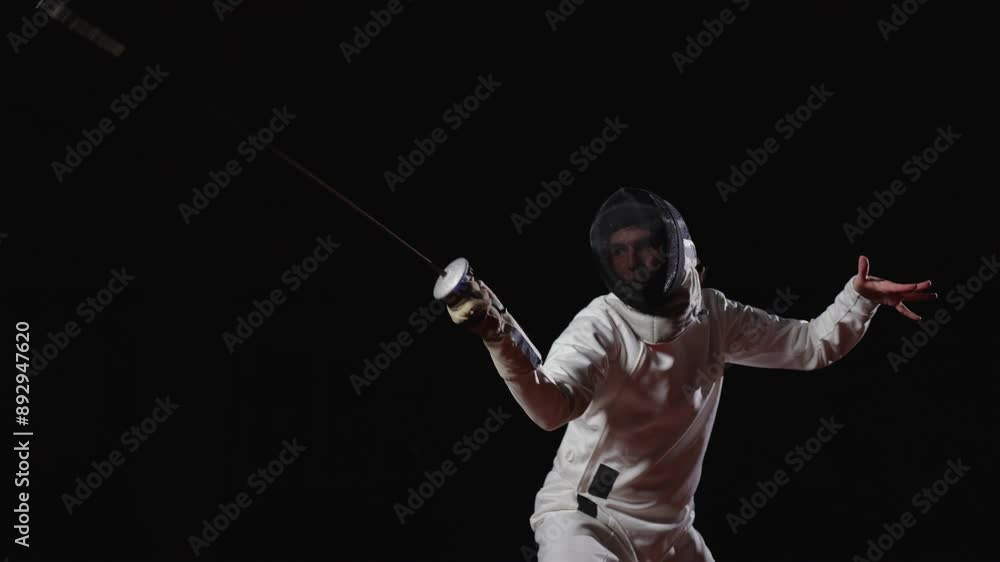 Figure Of Professional Swordsman In Darkness, Moving And Fighting, Practicing Attack Figure Of Professional Swordsman In Darkness, Moving And Fighting, Practicing Attack