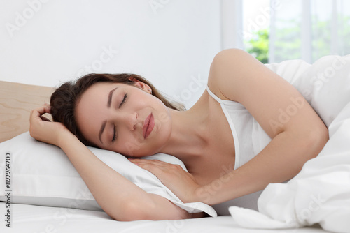 Bedtime. Woman sleeping in bed at home