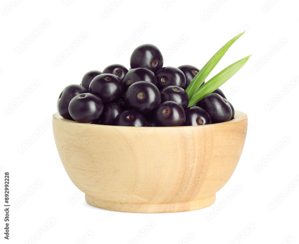 Fresh ripe acai berries in bowl and green leaves isolated on white Fresh ripe acai berries in bowl and green leaves isolated on white