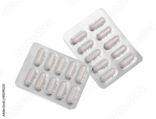 Antibiotic pills in blisters isolated on white, top view