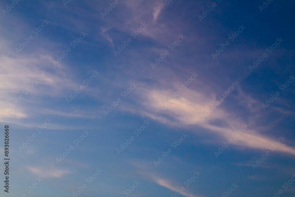 Clouds with warm light and blue sky in the afternoon Clouds with warm light and blue sky in the afternoon
