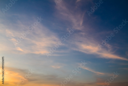 Clouds with warm light and blue sky in the afternoon