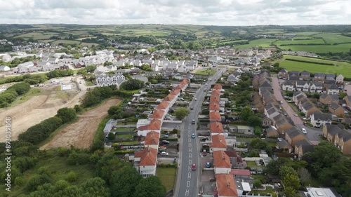 Aerial view of Stratton in Bude, Cornwall, capturing the extensive layout of residential homes, community areas, and the surrounding countryside photo