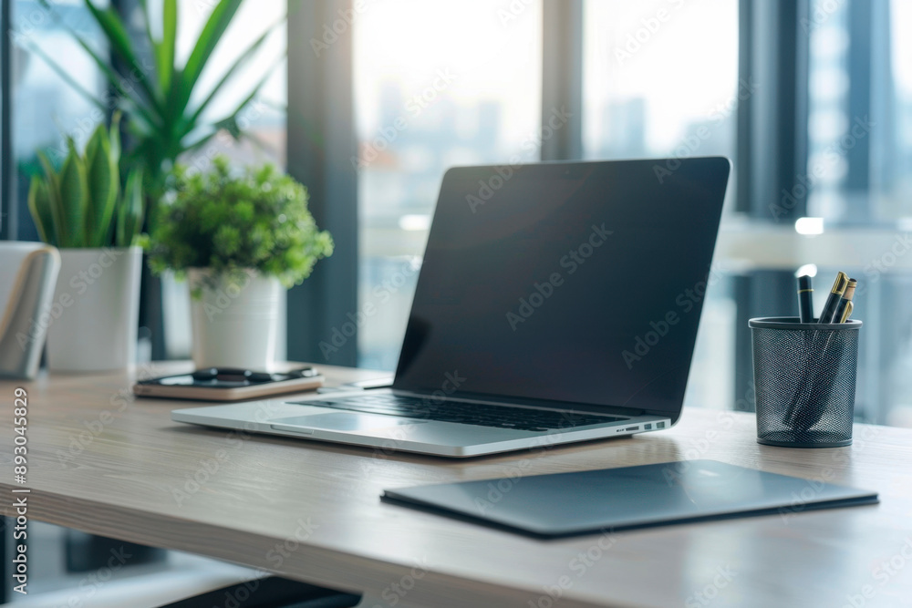 Close-up of a laptop on a table in a modern office Close-up of a laptop on a table in a modern office