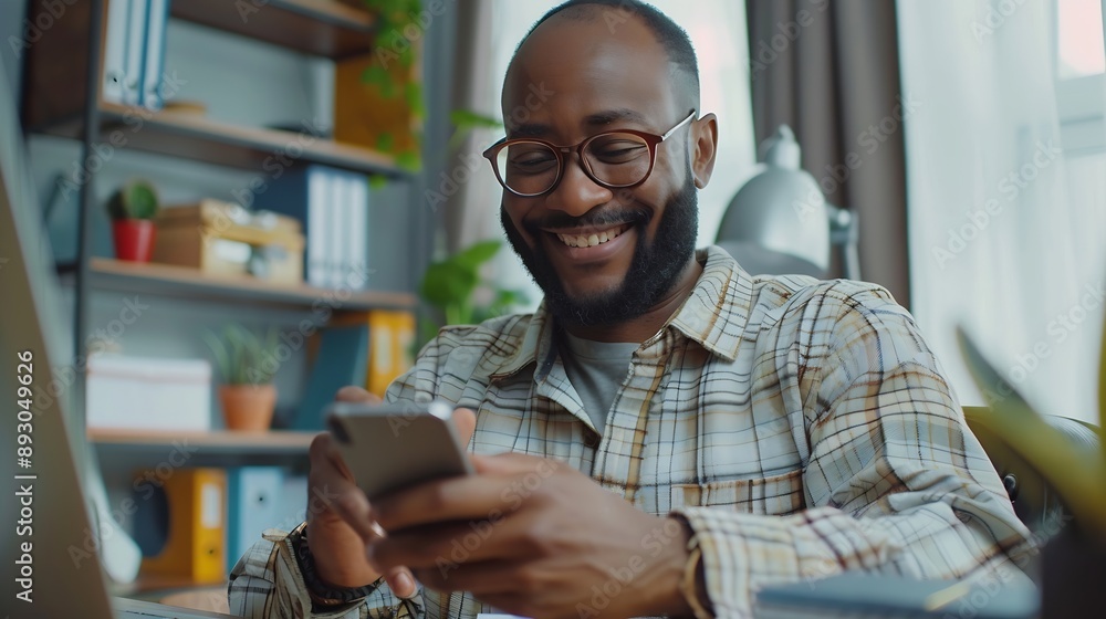 Happy smiling businessman wearing casual clothes and using modern smartphone in his home office successful employer sitting at desk typing on mobile phone : Generative AI Happy smiling businessman wearing casual clothes and using modern smartphone in his home office successful employer sitting at desk typing on mobile phone : Generative AI