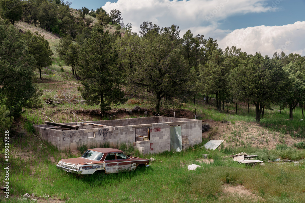 Abandoned rusted car on farmland near Taos, New Mexico, United States Of America. Abandoned rusted car on farmland near Taos, New Mexico, United States Of America.
