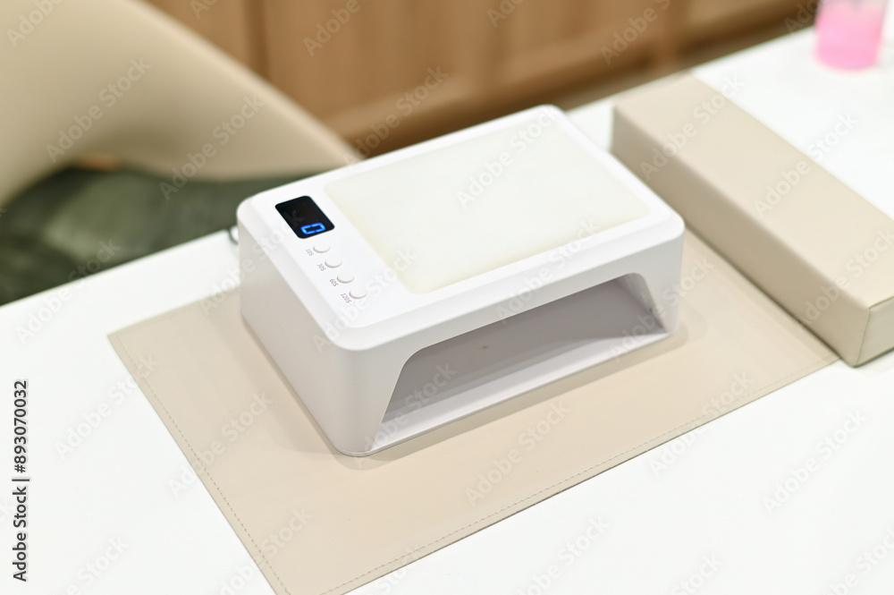 UV nail curing lamp for acrylic or gel nails and gel polish. Device for beauty salon UV nail curing lamp for acrylic or gel nails and gel polish. Device for beauty salon