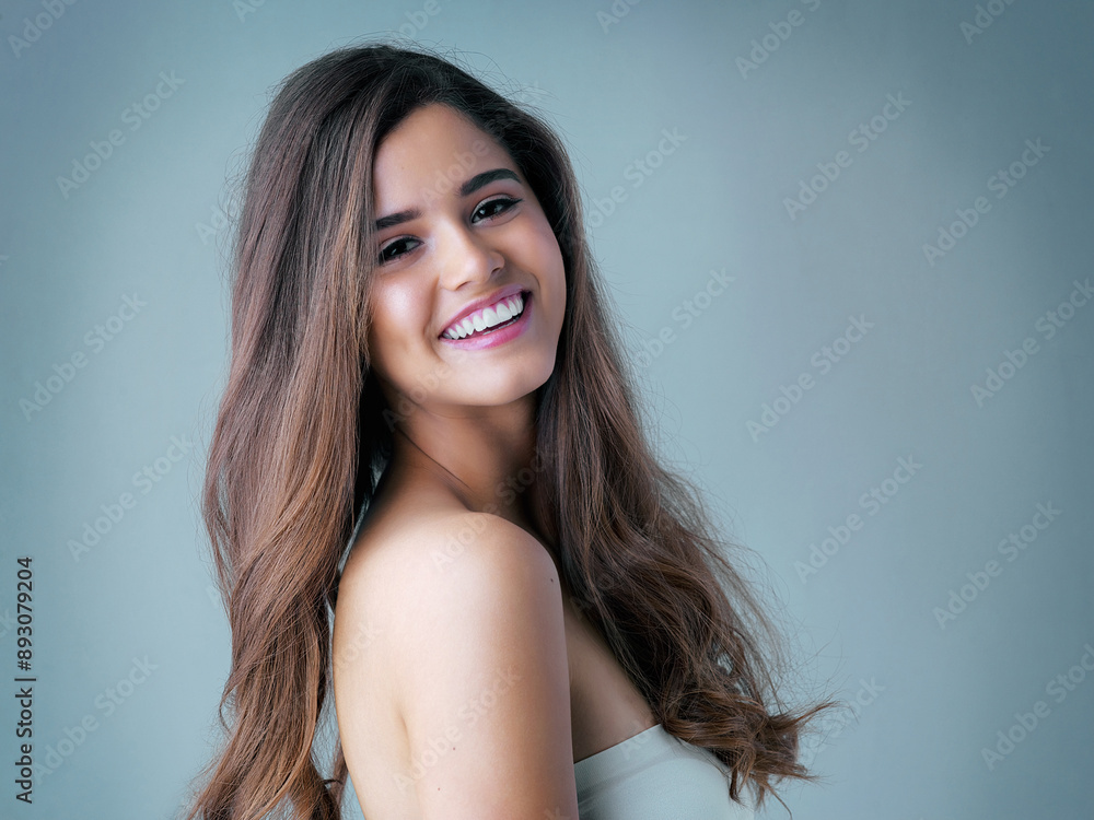 Portrait, confidence and happy woman in studio with hair care, cosmetic results or luxury shampoo treatment. Smile, texture and girl with trendy hairstyle, keratin therapy and blue background mockup Portrait, confidence and happy woman in studio with hair care, cosmetic results or luxury shampoo treatment. Smile, texture and girl with trendy hairstyle, keratin therapy and blue background mockup