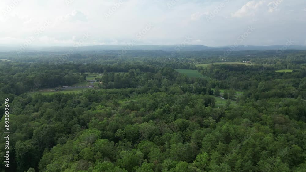 hyperlapse clouds moving over mountains (trees shaking) drone footage of catskills (blue hills of catskill mountain) cloudy dramatic sky cloud formations time lapse hyperlapse clouds moving over mountains (trees shaking) drone footage of catskills (blue hills of catskill mountain) cloudy dramatic sky cloud formations time lapse