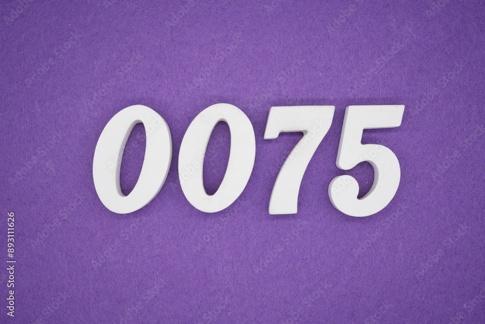 The numbers are made of white paint wood, placed on the background as a purple paper. The numbers are made of white paint wood, placed on the background as a purple paper.