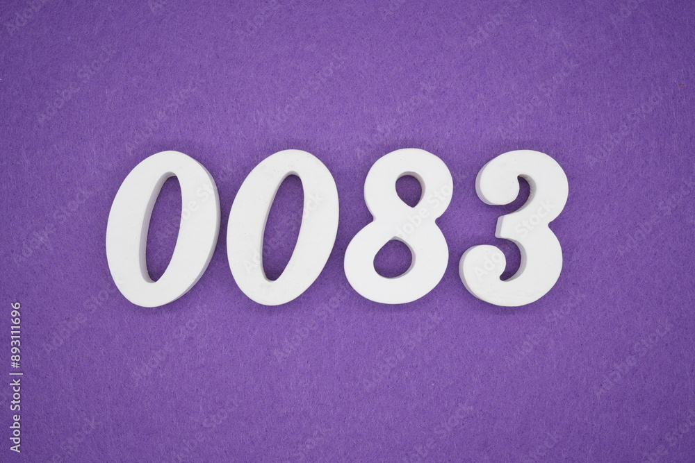 The numbers are made of white paint wood, placed on the background as a purple paper. The numbers are made of white paint wood, placed on the background as a purple paper.