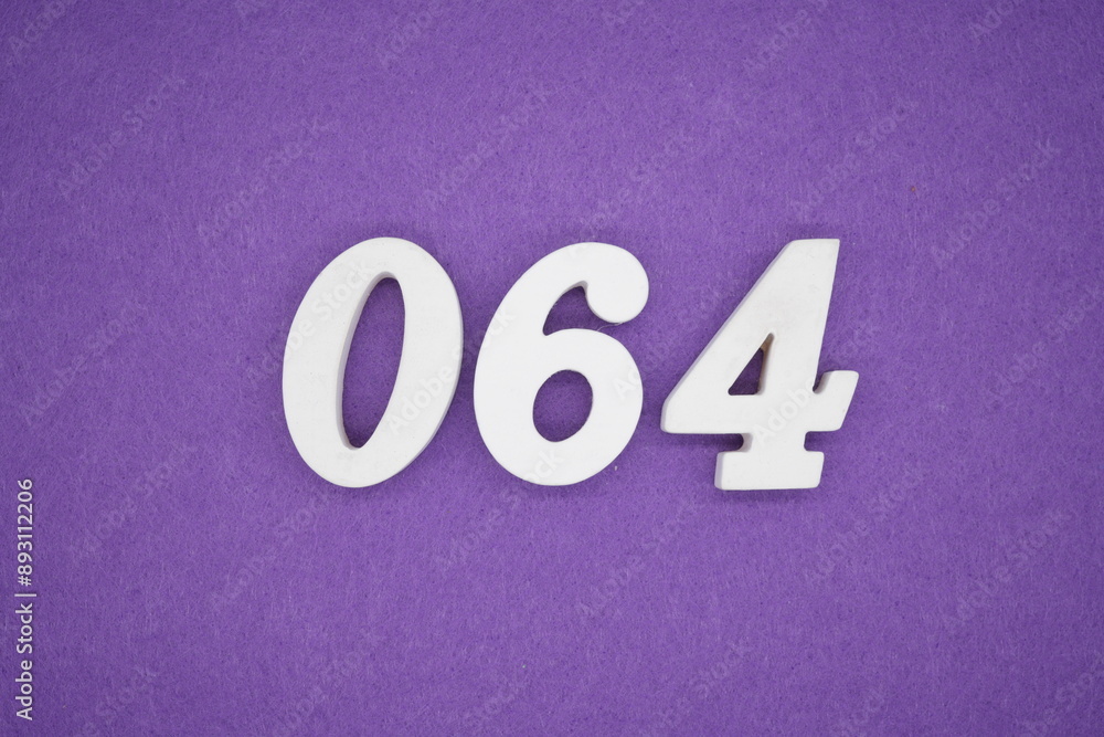 The numbers are made of white paint wood, placed on the background as a purple paper. The numbers are made of white paint wood, placed on the background as a purple paper.