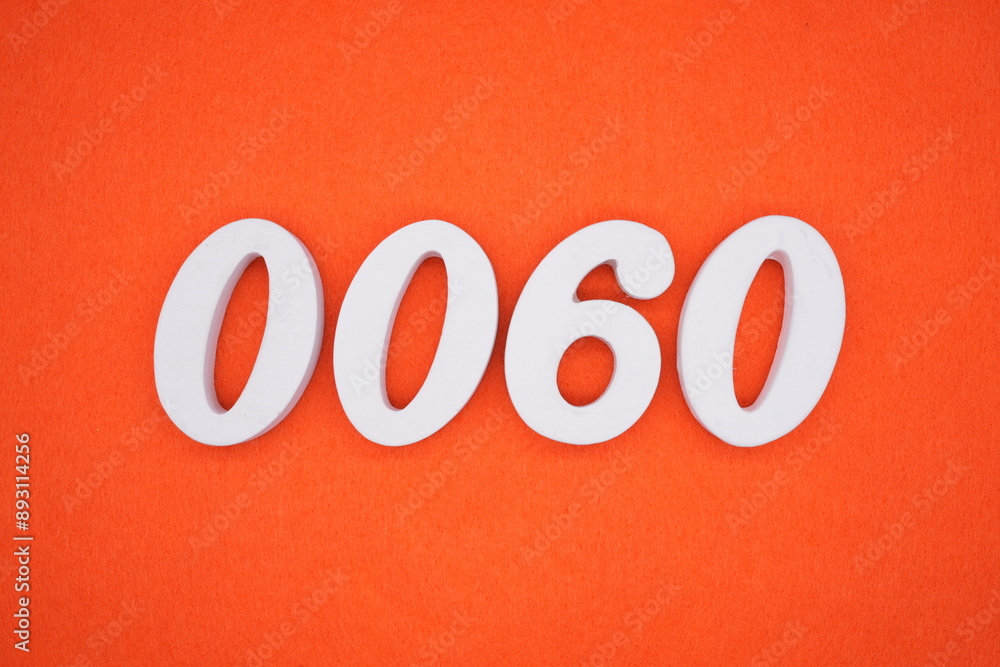 The numbers are made of white painted wood. Placed on the floor was orange paper. The numbers are made of white painted wood. Placed on the floor was orange paper.