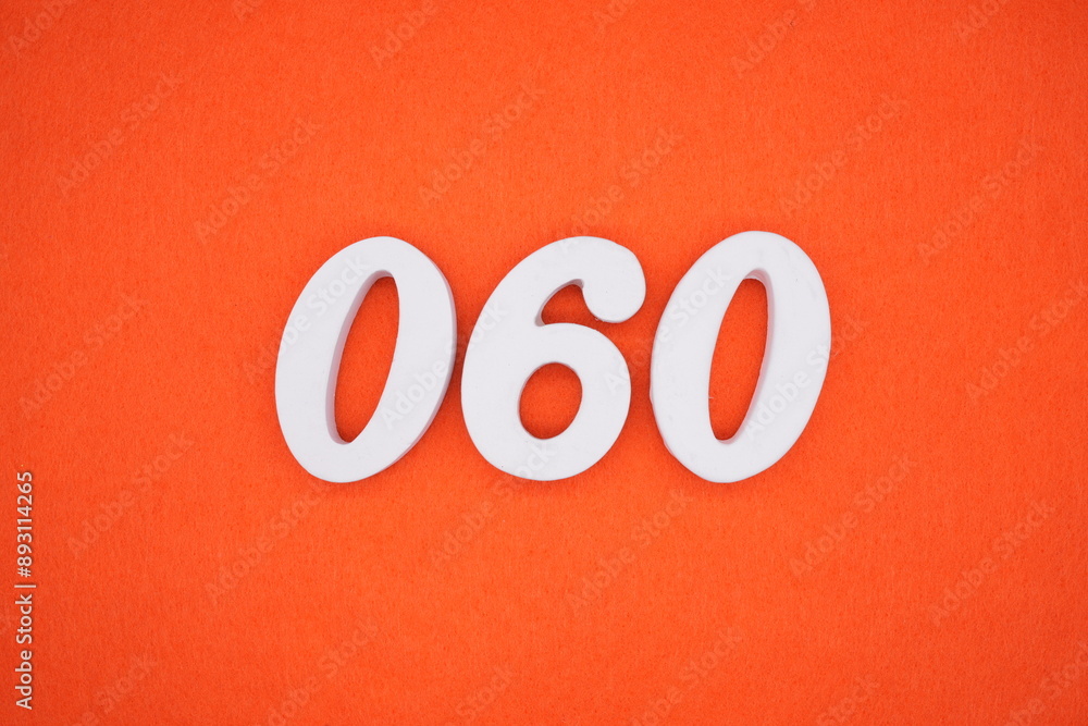 The numbers are made of white painted wood. Placed on the floor was orange paper. The numbers are made of white painted wood. Placed on the floor was orange paper.