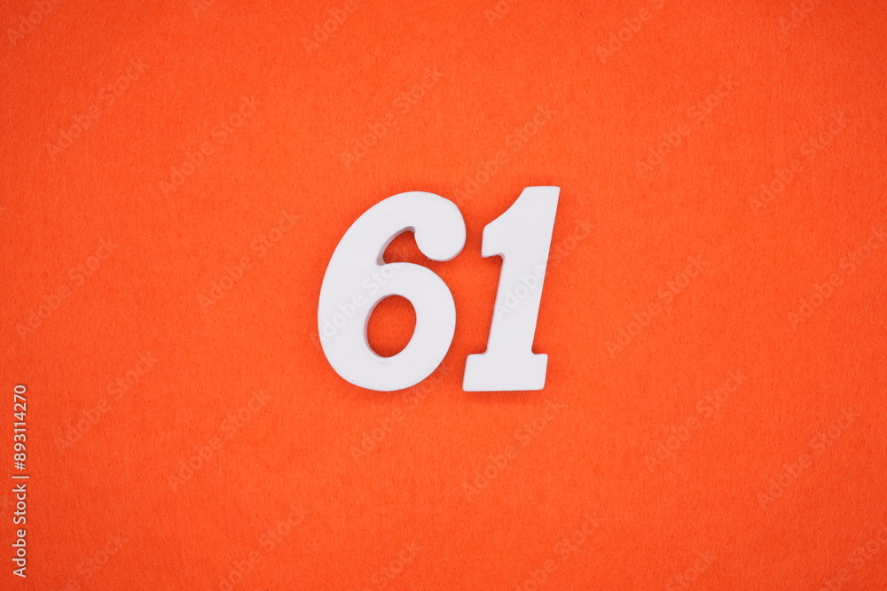 The numbers are made of white painted wood. Placed on the floor was orange paper. The numbers are made of white painted wood. Placed on the floor was orange paper.