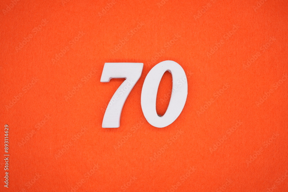The numbers are made of white painted wood. Placed on the floor was orange paper. The numbers are made of white painted wood. Placed on the floor was orange paper.