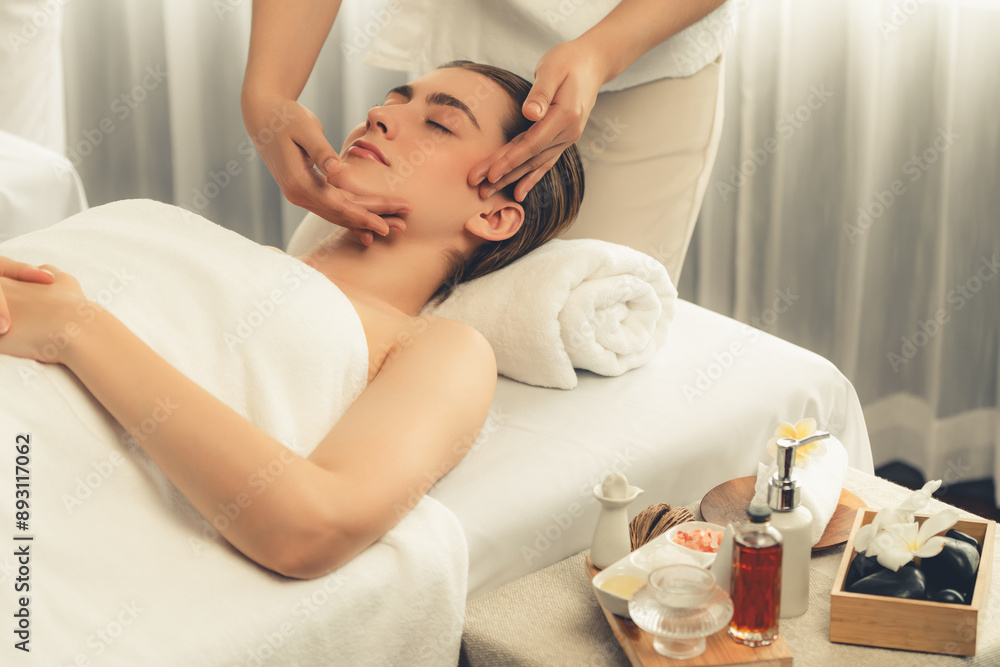 Obraz premium Caucasian woman enjoying relaxing anti-stress head massage and pampering facial beauty skin recreation leisure in dayspa modern light ambient at luxury resort or hotel spa salon. Quiescent